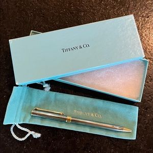 Tiffany & Co Pen. Silver with gold accents.